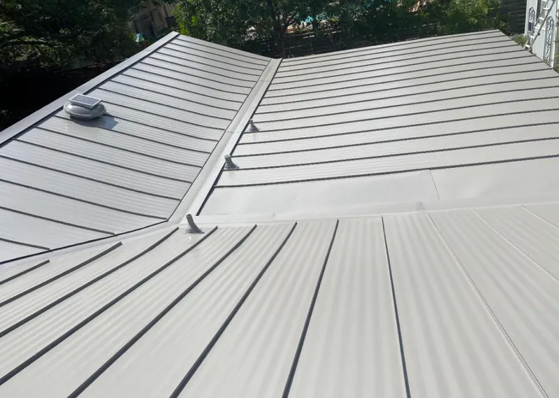 Solar attic fan installed on a metal roof for Roof Ventilation in Oregon City
